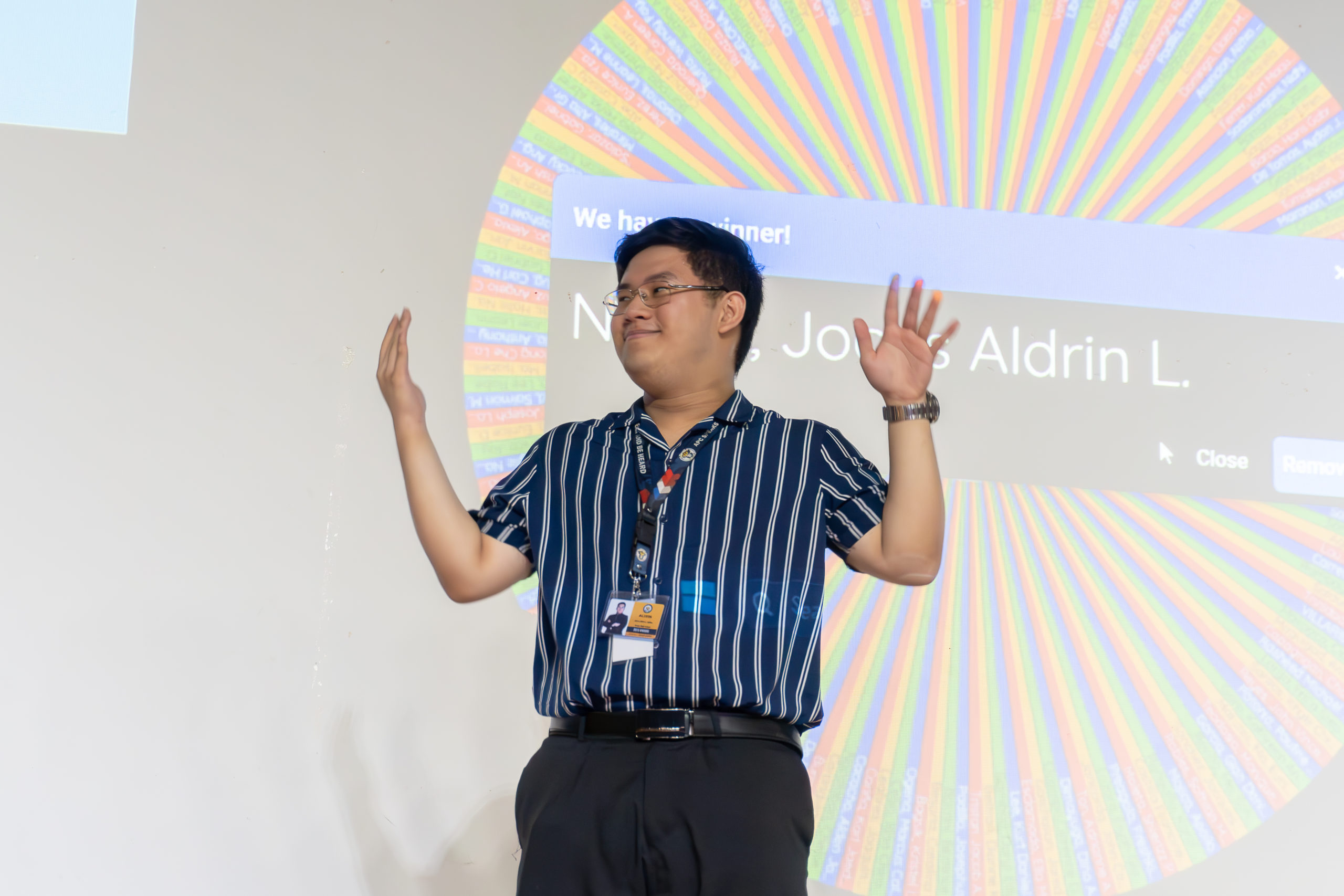 Jocas Nellas, Deputy Finance Officer of APC Student Organization Association of Regents (APC SOAR), wins the opening ceremony raffle along with two other winners. Photo by Johann Avery Marcalas