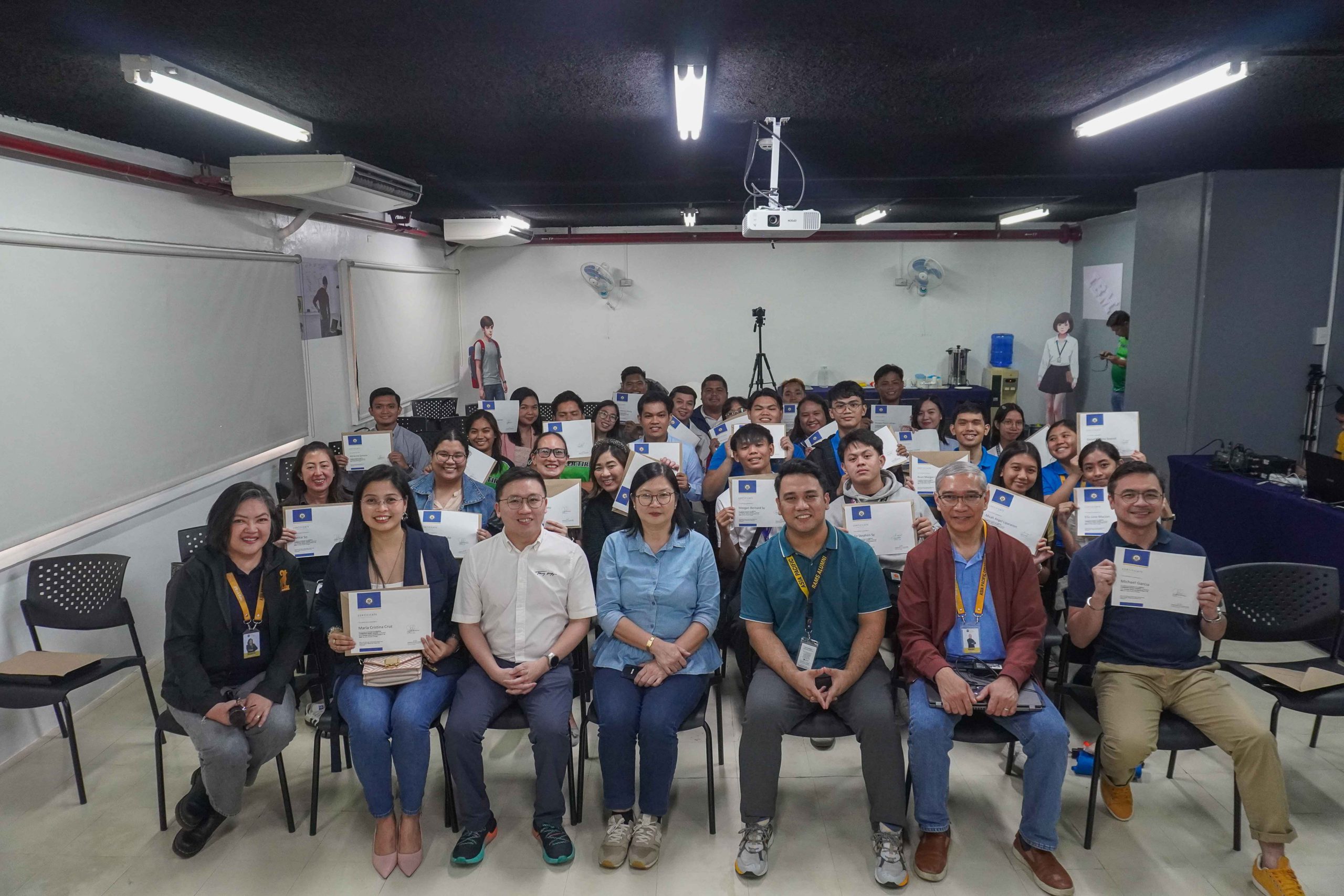 Asia Pacific College faculty and staff, along with Mrs. Lourdes Lim Wang and Mr. Jefferson Wang